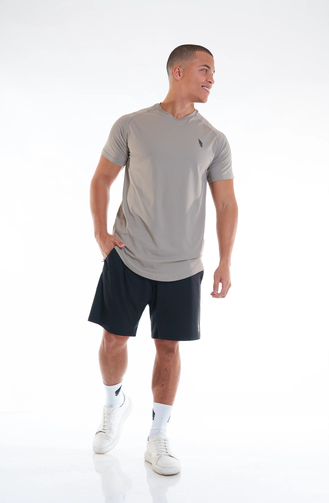 NIVɅYS ® a man wearing zeyla performance shorts obsidian black full view