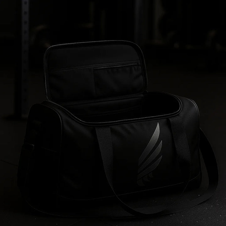 Open NIVɅYS gym bag showing its spacious interior and organization, made from sustainable materials.