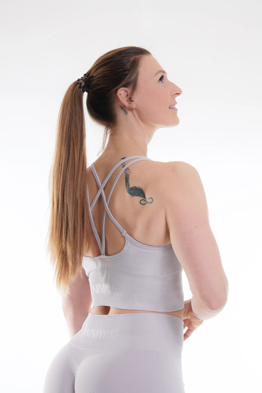 NIVɅYS sports bra featuring supportive design and sustainable recycled performance fabric.